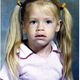 Illustration for article titled Goofy Glasses, Pretty Pigtails & Snaggletooth Smiles: September Is For School Portraits